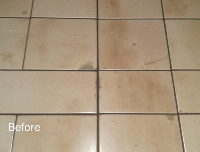 Dirty residential tile floor with stained grout lines before professional cleaning in Metro Detroit home